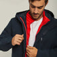 Man wearing a navy hooded jacket with red quilted inner lining and white t-shirt