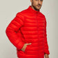 Man wearing a bright red puffer jacket with front zip and blue jeans, casual style