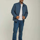 Man wearing a blue casual jacket, white t-shirt, blue jeans, and white sneakers