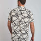 Man wearing short sleeve white shirt with bold black abstract lines, back view
