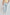Dalydress men's light blue pants paired with beige shirt and white sneakers