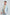 Man wearing Dalydress light blue suit and beige polo shirt, stylish men's fashion