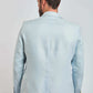 Back view of man wearing light blue Dalydress suit against plain background