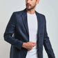 Man in a navy Dalydress suit jacket and white shirt, stylish men's fashion, Egyptian brand