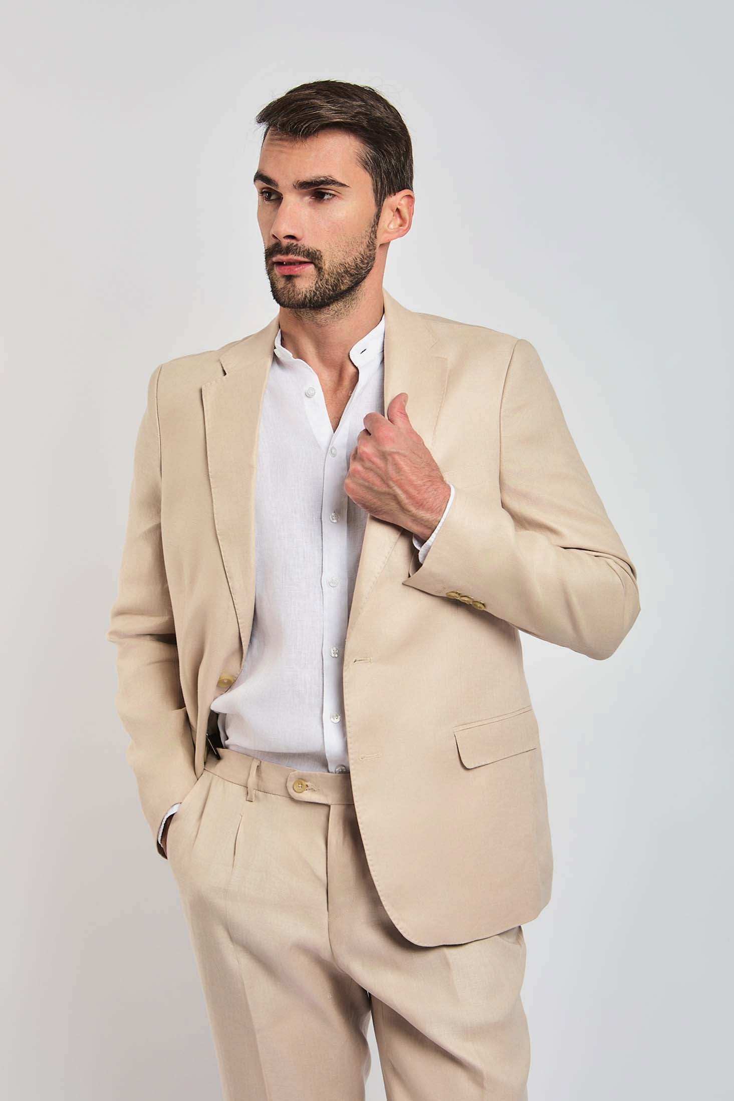 Man wearing beige suit and white shirt, Dalydress menswear, modern Egyptian fashion
