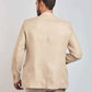 Back view of a man wearing a beige Dalydress suit, showcasing men's formal wear style.
