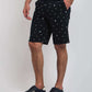 Dalydress men's black shorts with white nautical print, paired with striped shirt and sneakers