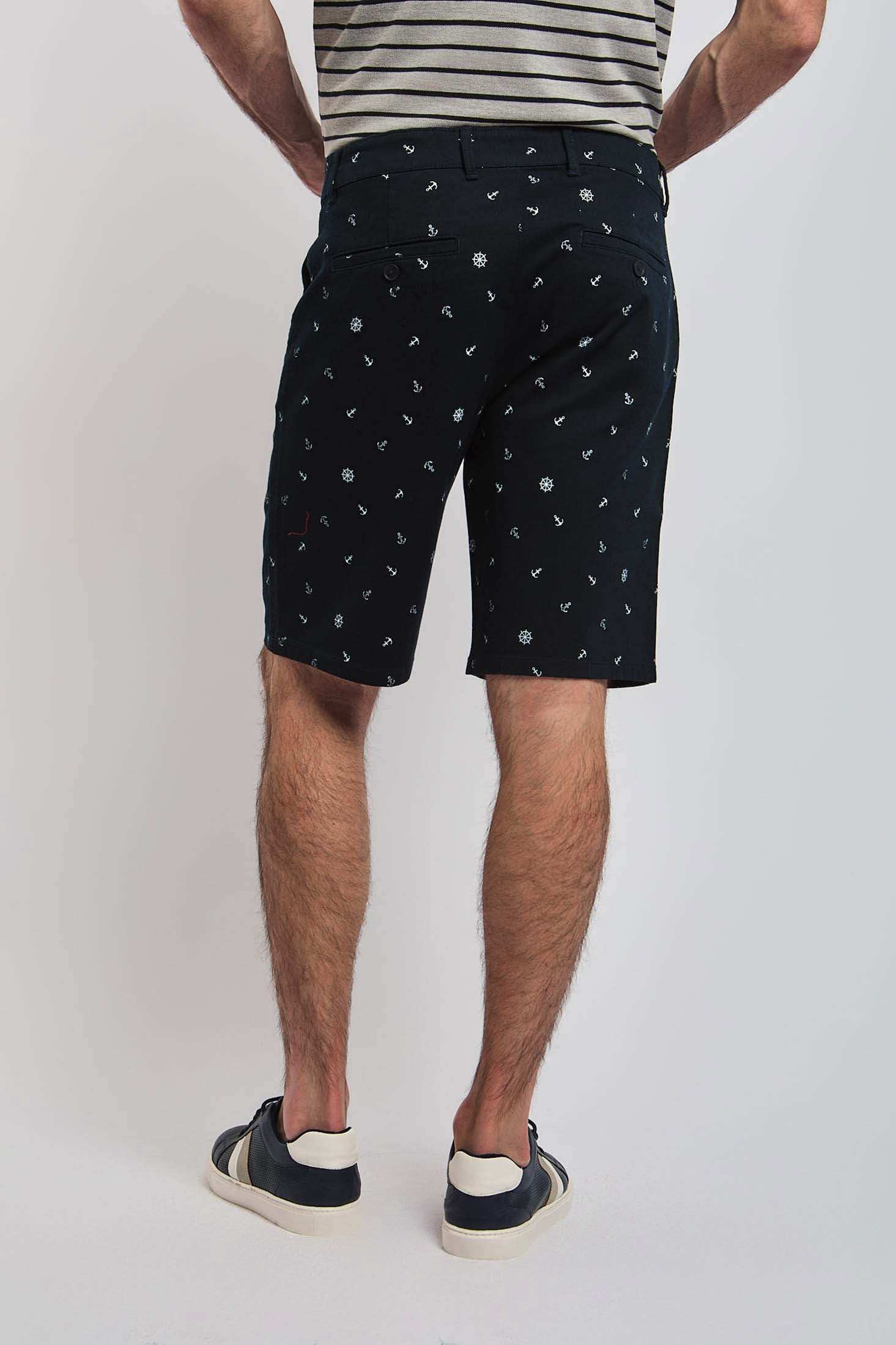 Dalydress men's black printed shorts, back view, paired with striped t-shirt and sneakers