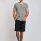 Dalydress men's casual look with striped t-shirt and printed shorts, fashion photoshoot