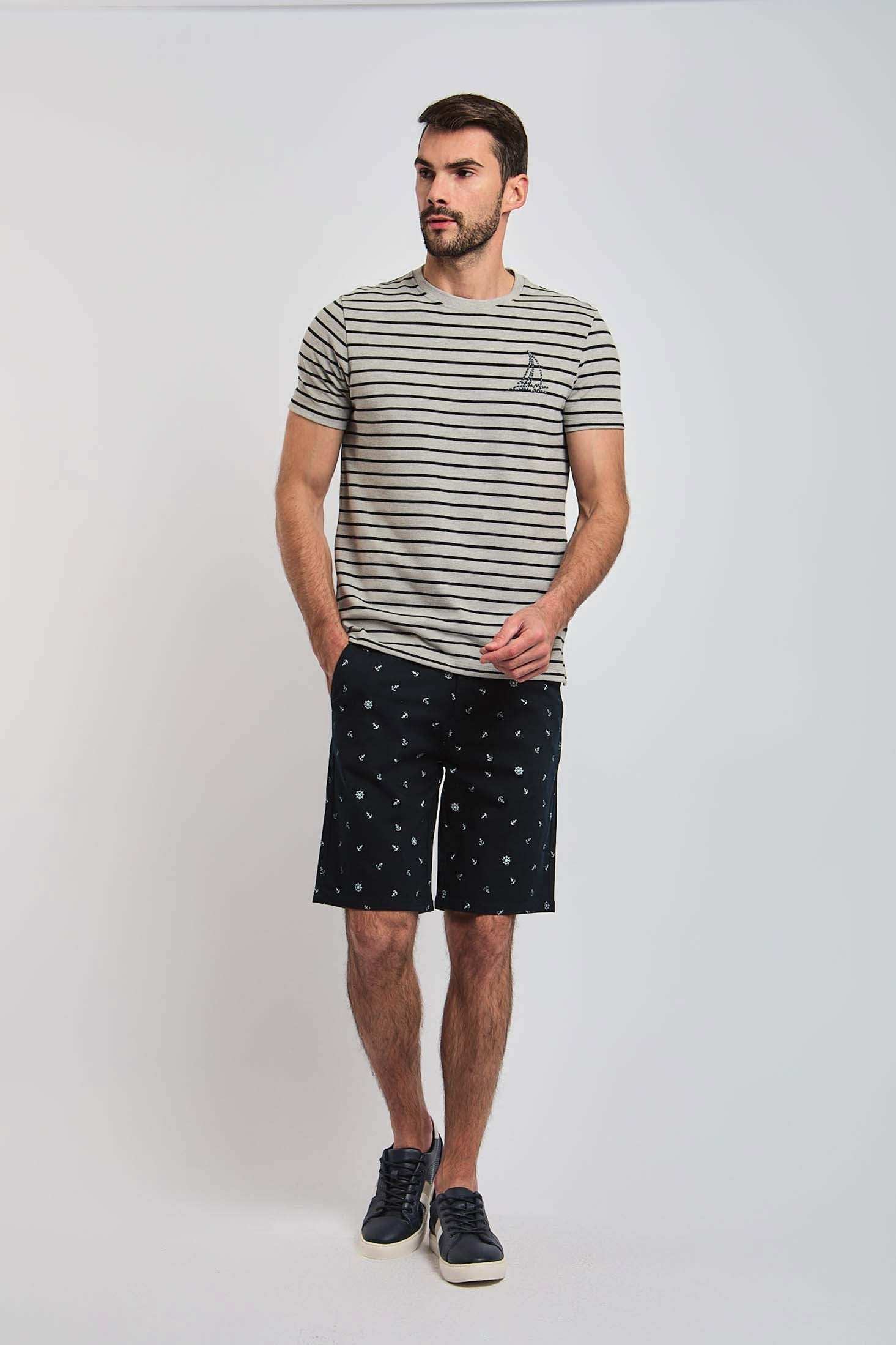 Dalydress men's casual look with striped t-shirt and printed shorts, fashion photoshoot