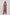 Woman wearing a long, sheer printed kimono over brown wide-leg pants, fashion photoshoot