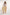 Woman in sleeveless lilac top and yellow floral maxi skirt from Dalydress standing on white background