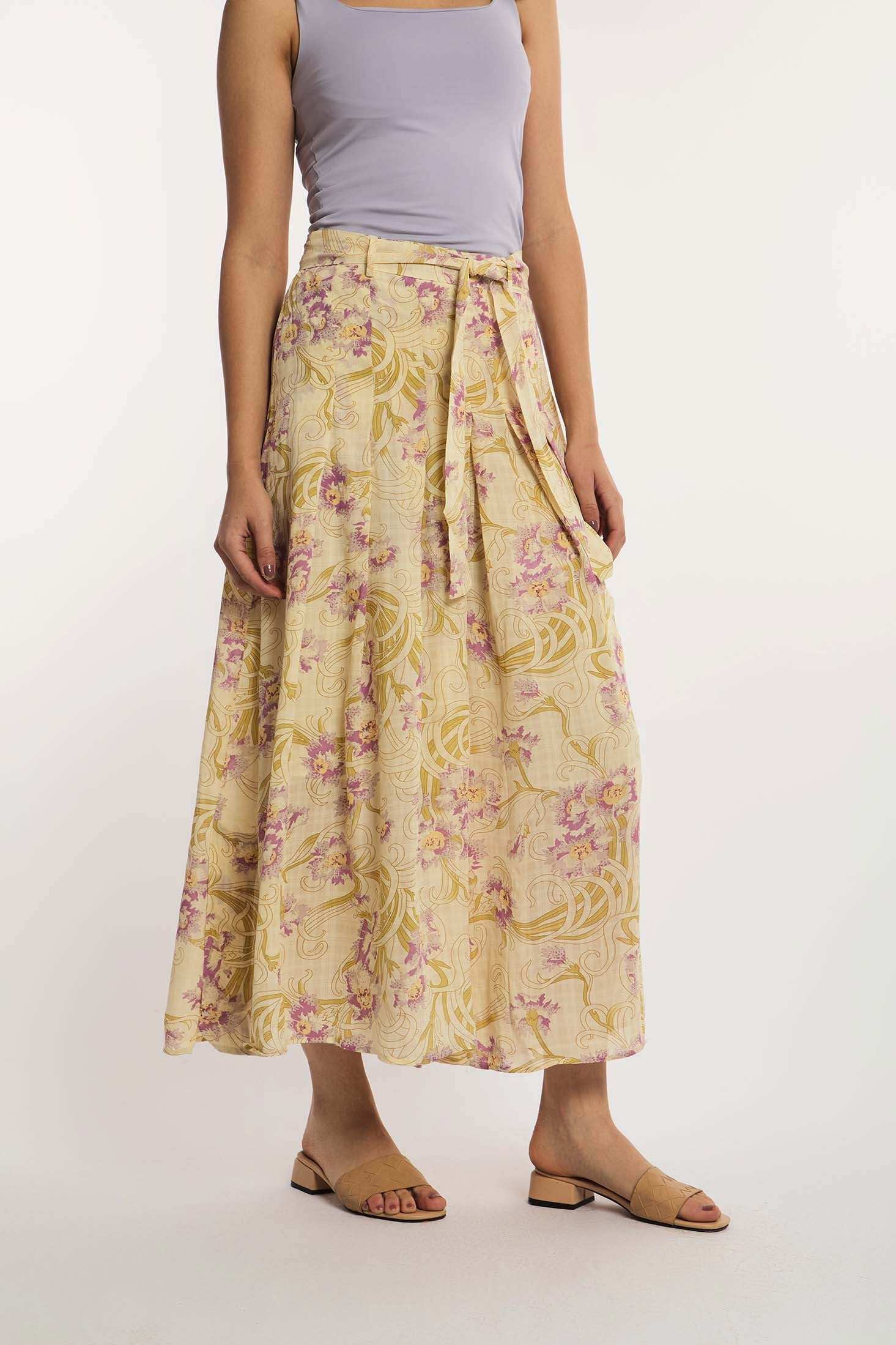 Woman wearing Dalydress floral maxi skirt with tie waist and lilac tank top