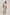 Woman wearing beige linen suit with tie-waist pants and white top, Dalydress collection