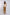 Woman modeling Dalydress floral ruffle top with mustard wide-leg pants, casual chic look