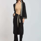 Woman wearing Dalydress black kimono set with geometric trim and beige top, standing in studio