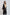Woman modeling Dalydress black long cardigan with beige geometric trim, casual women's wear