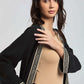 Dalydress women's black jacket with geometric trim, beige top, and matching belt