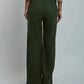 Dalydress women's green wide-leg pants with cream blouse, back view, studio setting