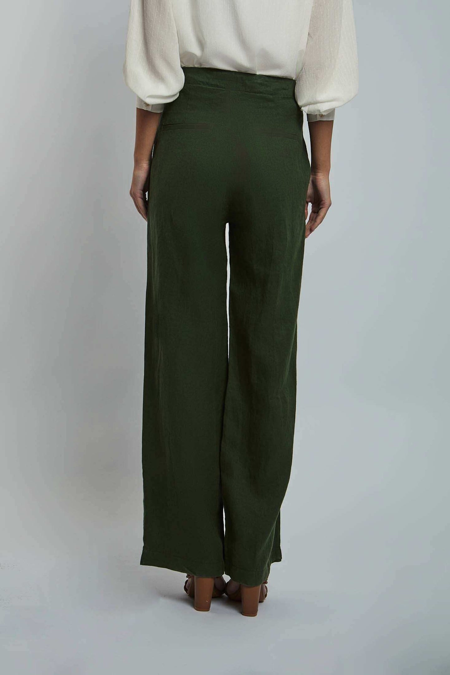 Dalydress women's green wide-leg pants with cream blouse, back view, studio setting