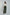 Woman wearing Dalydress white embroidered blouse and green wide leg pants