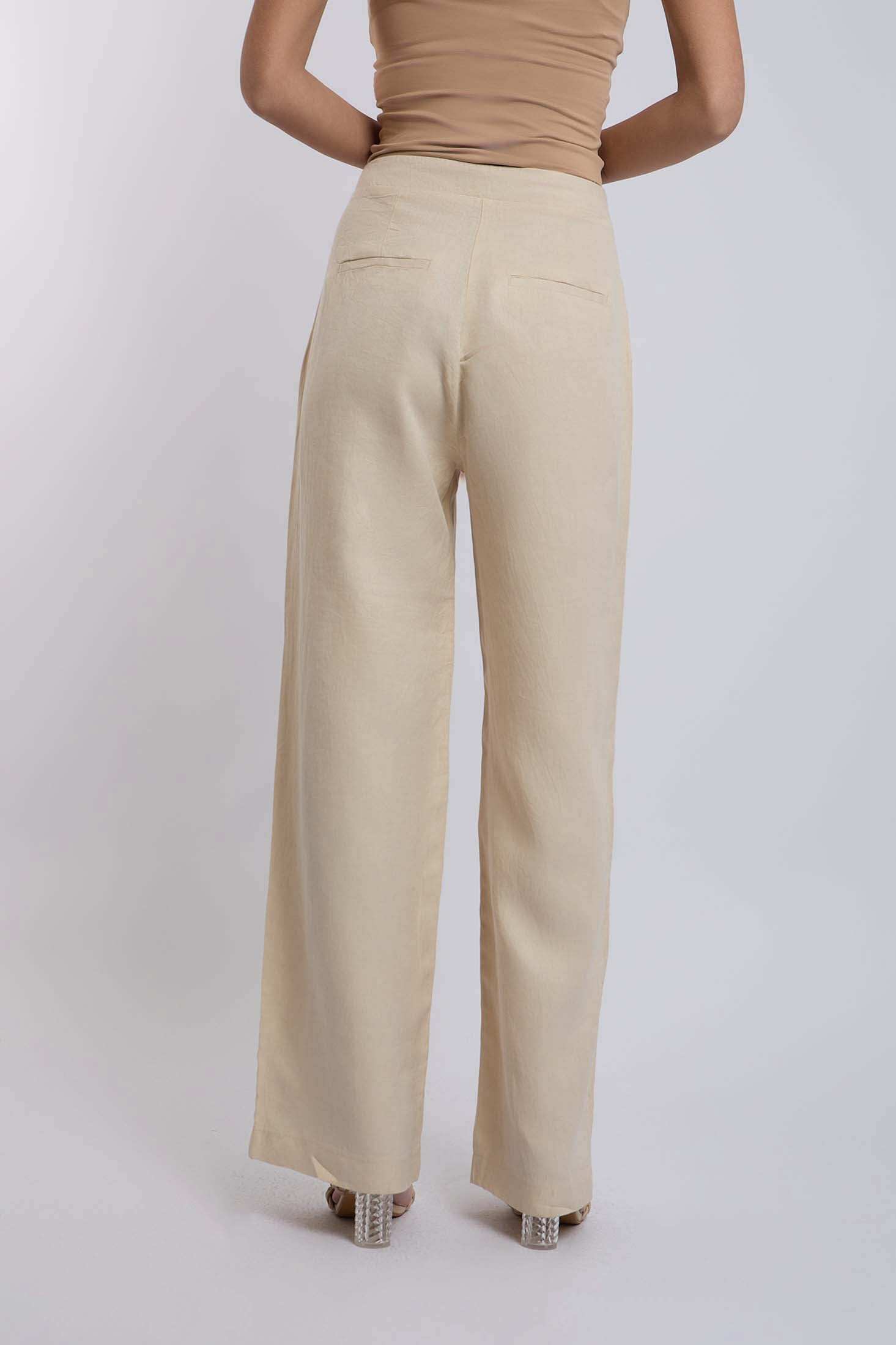 Dalydress women's beige wide-leg pants with back welt pockets, styled on model