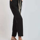 Dalydress women's black pants with patterned belt, side pockets, and tan sandals