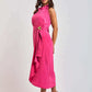 Woman modeling a sleeveless pink Dalydress midi dress with ruffled collar and waist belt