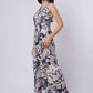 Woman modeling Dalydress sleeveless navy and white floral maxi dress, neutral heels, studio background