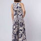 Woman in Dalydress sleeveless floral print jumpsuit, back view, casual chic fashion