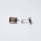 Silver square cufflinks with textured pattern on white background, men's accessories