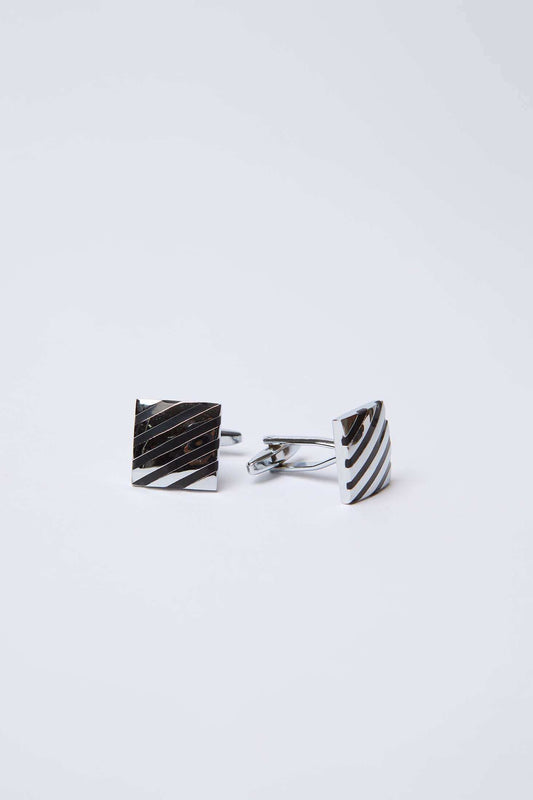 Square silver cufflinks with diagonal stripe pattern on a white background
