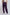 Woman wearing purple cargo jogger pants with elastic waistband and side pockets, back view