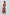 Woman in a sleeveless, floral print maxi dress with pink, blue, and brown tropical patterns