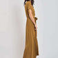 Woman in mustard yellow maxi dress with short sleeves and waist tie, side view