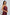 Woman modeling sleeveless burgundy satin top with spaghetti straps