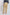 Woman wearing beige cargo pants with side pockets, back view, casual fashion style