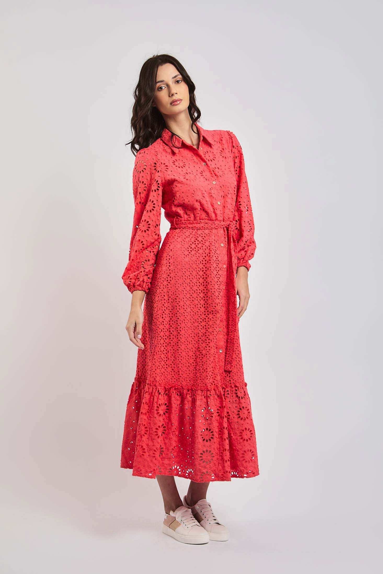 Woman in a coral eyelet midi dress with long sleeves and belt, Dalydress womenswear fashion