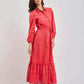 Woman in a coral eyelet midi dress with long sleeves and belt, Dalydress womenswear fashion