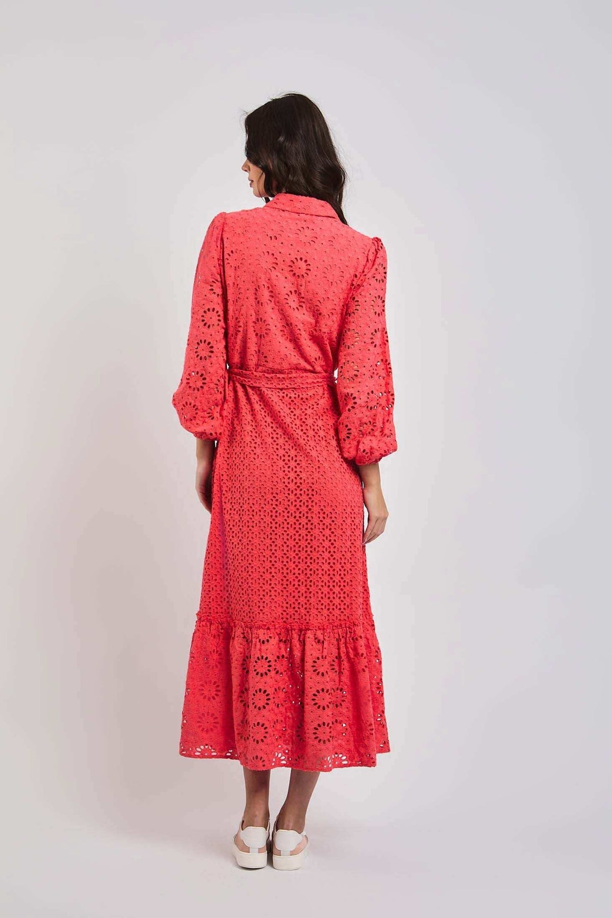 Woman wearing a coral eyelet midi dress with long sleeves, back view, Dalydress fashion
