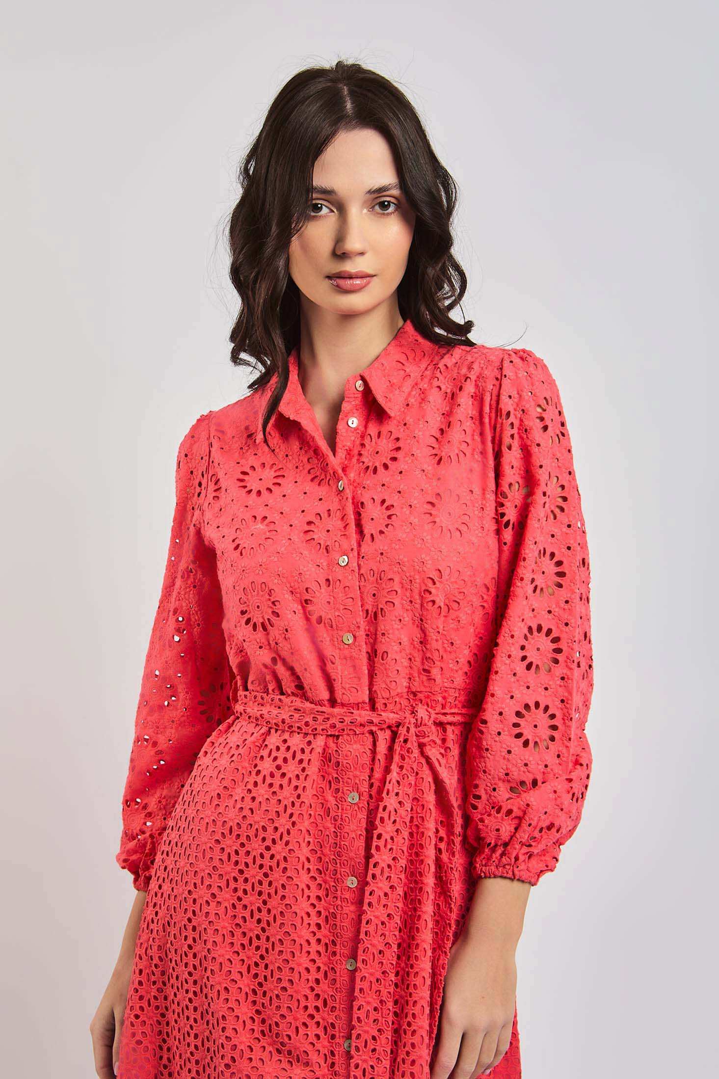 Woman wearing coral eyelet embroidered dress with belt from Dalydress collection