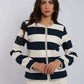 Dalydress women's striped navy and white blazer with pearl trim, white pants, studio background