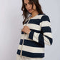 Woman wearing Dalydress navy and white striped blazer with pearl trim, urban fashion