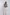 Woman modeling Dalydress navy and white striped jacket with cream trousers, studio background