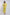 Woman wearing yellow embroidered pantsuit with white floral patterns, standing indoors