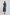 Woman wearing Dalydress blue polka dot pleated midi dress with long sleeves