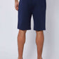 Dalydress men's navy blue casual shorts, back view, styled with white sneakers on model