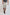 Man wearing Dalydress grey drawstring shorts and striped t-shirt, casual men's fashion