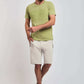 Dalydress casual men's outfit with light green t-shirt and beige shorts, white sneakers