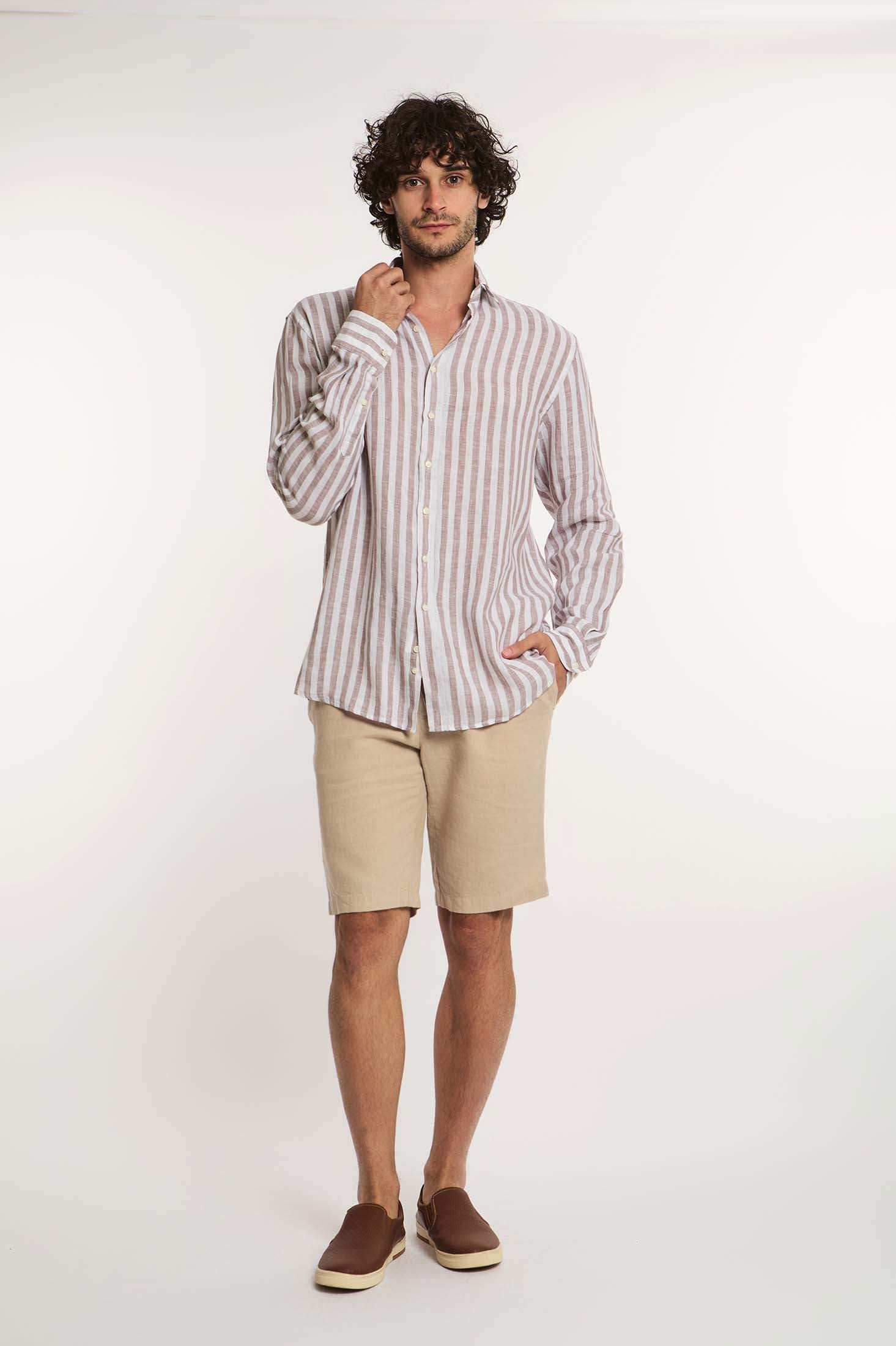 Man wearing Dalydress striped long sleeve shirt with beige shorts and brown slip-on shoes